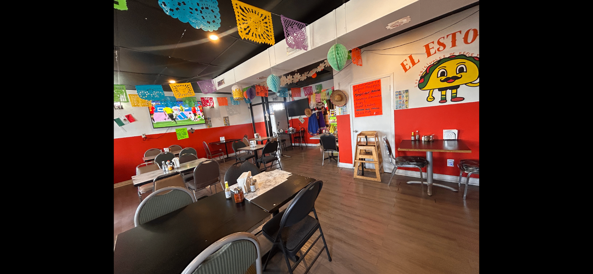Dining room with papel picado and Mexican decor